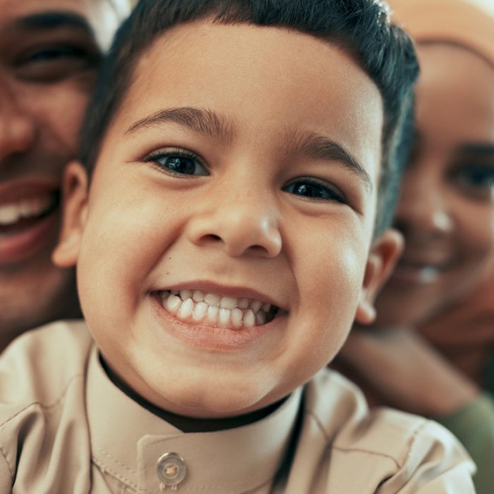 muslim-family-smile-and-portrait-selfie-in-house-2024-07-11-20-56-40-utc Muslim family, smile and portrait selfie in house, together and bonding with boy. Hijab mother, fat.